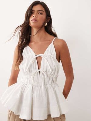 ARRANGE tie front ruched peplum cami top